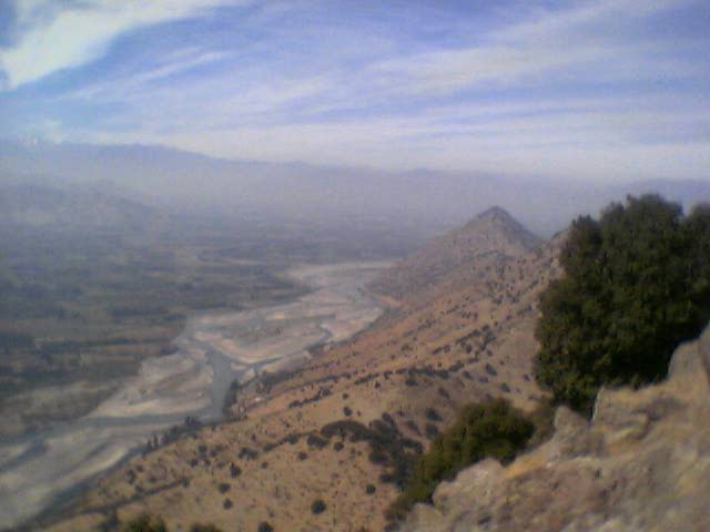 Een zicht over de vallei en de Rio Loco